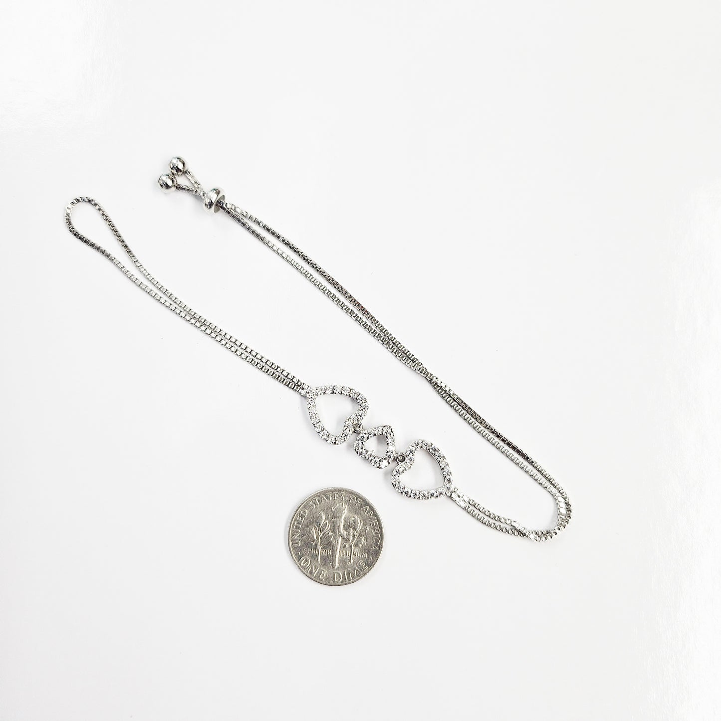 Connected Hearts Hand Chain in White Goldplated