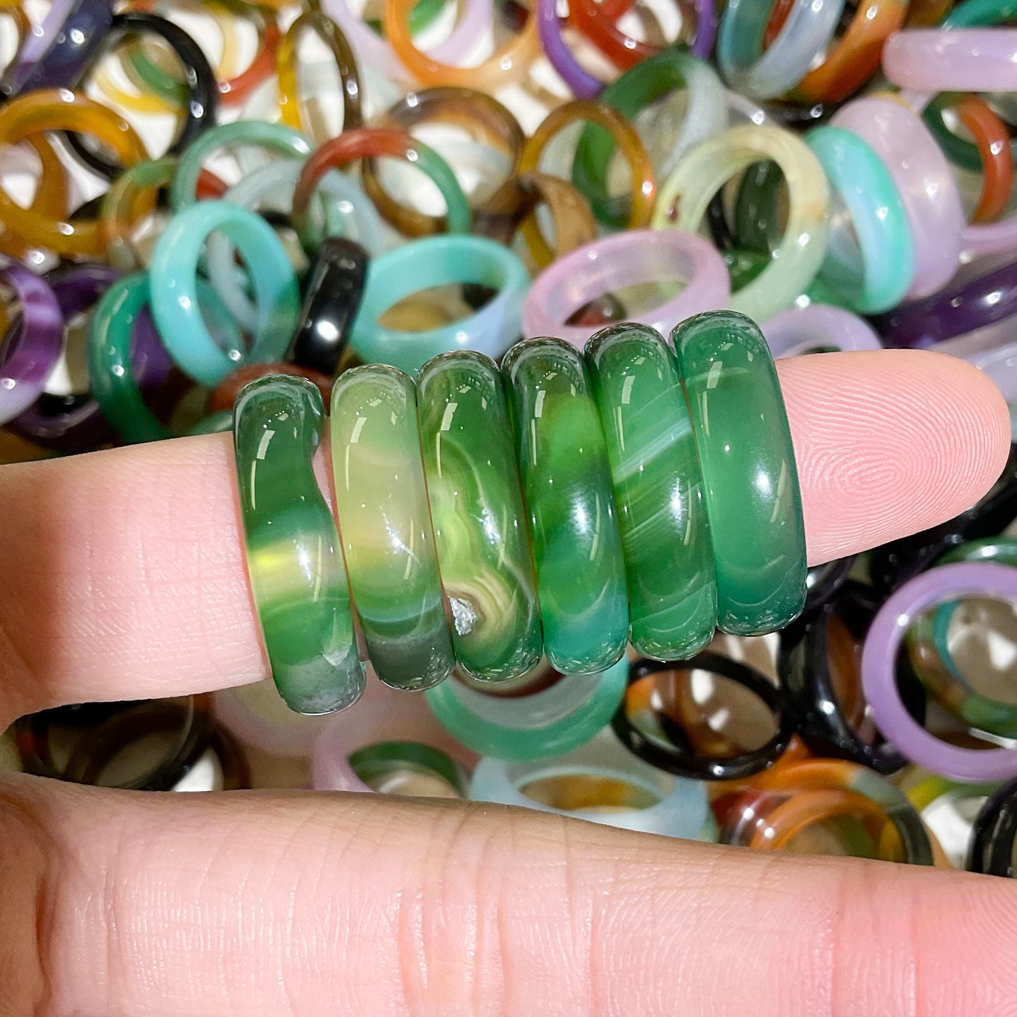 forest emerald green banded agate modeled on finger